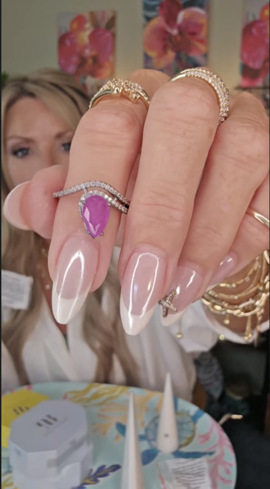 Pink pear-stone ring with a crystal wave band, worn moments after the reveal